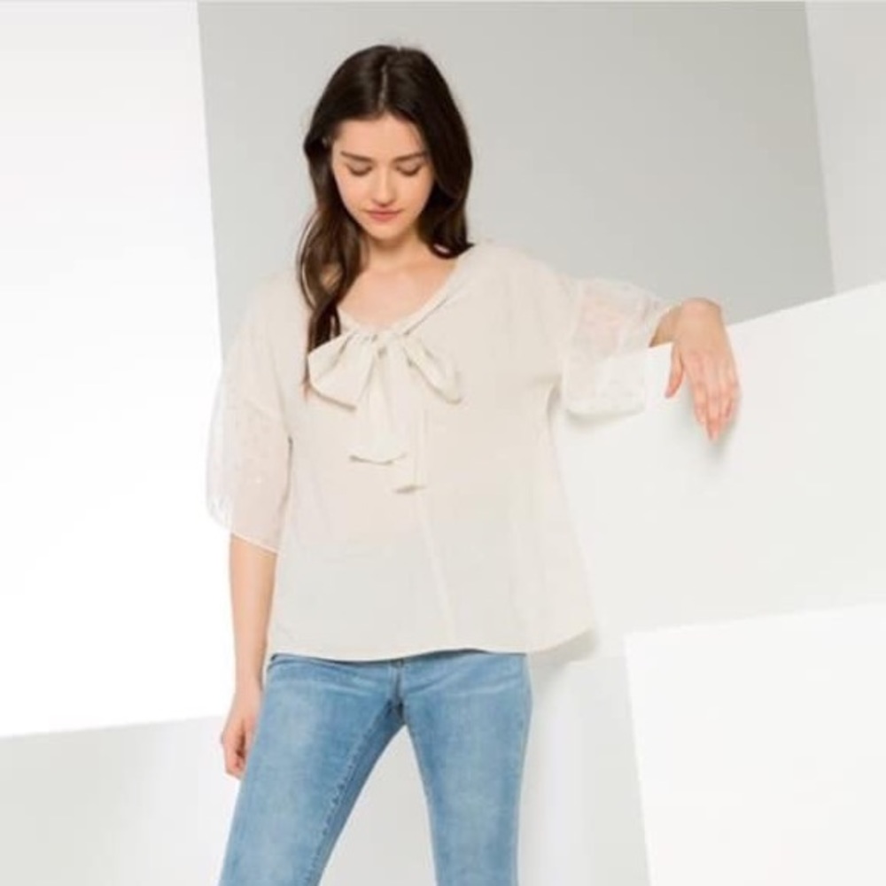 Cream top with gold on sleeves